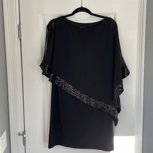 Black dress with sheer overlay and sequence. Wore twice. Like new condition.